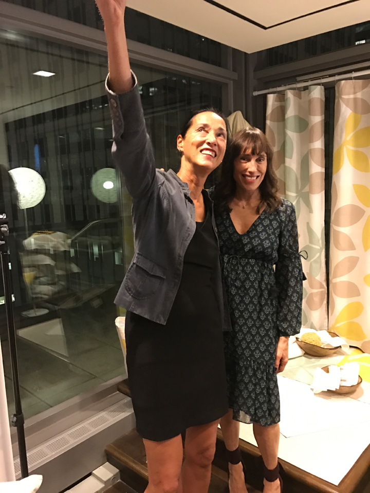 Judy Ross and Dovanna Pagowski pose for a selfie in front on the bath collection